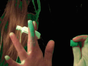 fingers with green paint