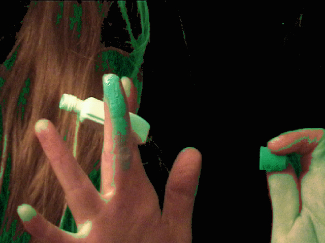fingers with green paint