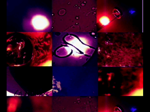 video still of close up abstract shapes in reds and purples